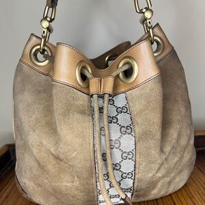 Authentic Gucci GG Suede Monogram Drawstring Handbag (Serial No. 120913213317)